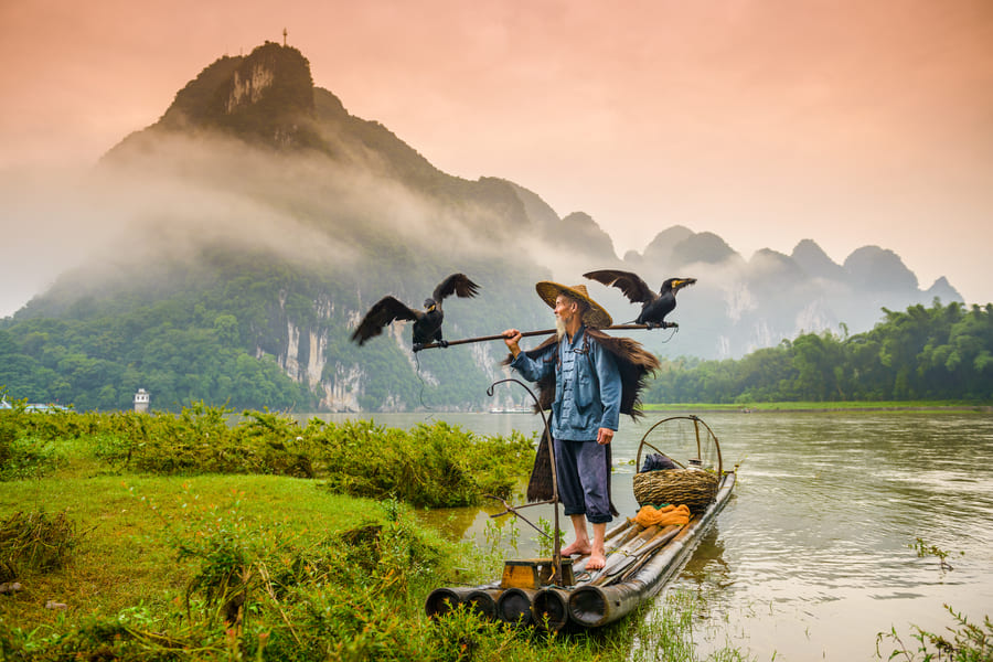 destino china pajaros canoa y montanas